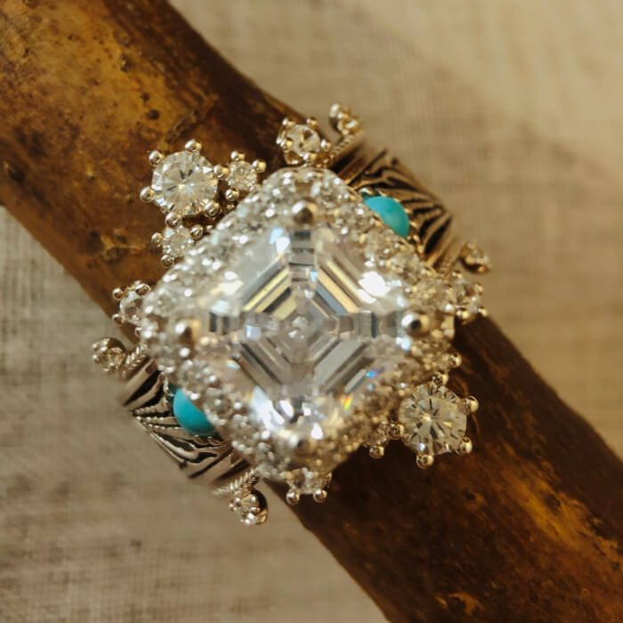 Radiant cut diamond vintage ring with turquoise accents and silver detailing