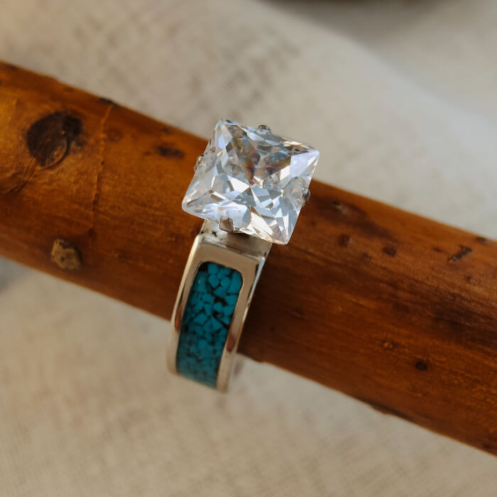 Steel wedding ring with blue turquoise inlay and princess cut zircon stone.