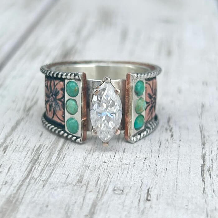 Detailed flower engraved ring with zircon and turquoise accents on silver band