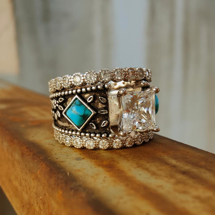 Vintage turquoise ring with princess-cut diamond and intricate engravings