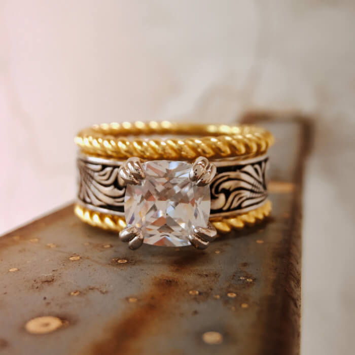 Gold and silver Western-style ring with a large emerald cut zircon stone