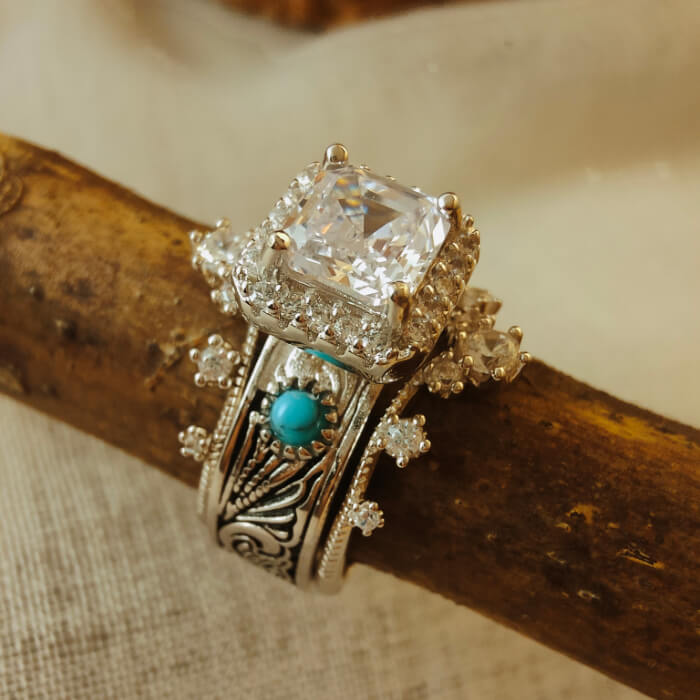 Vintage turquoise engagement ring with radiant cut diamond and silver floral accents