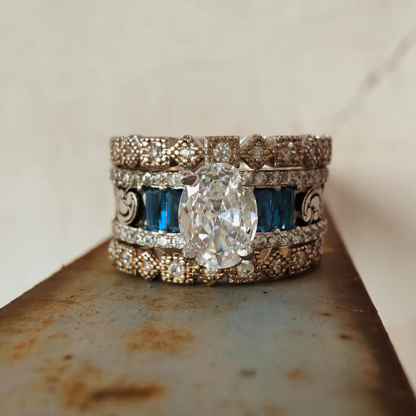 Vintage wide band ring with oval diamond and blue sapphire accents