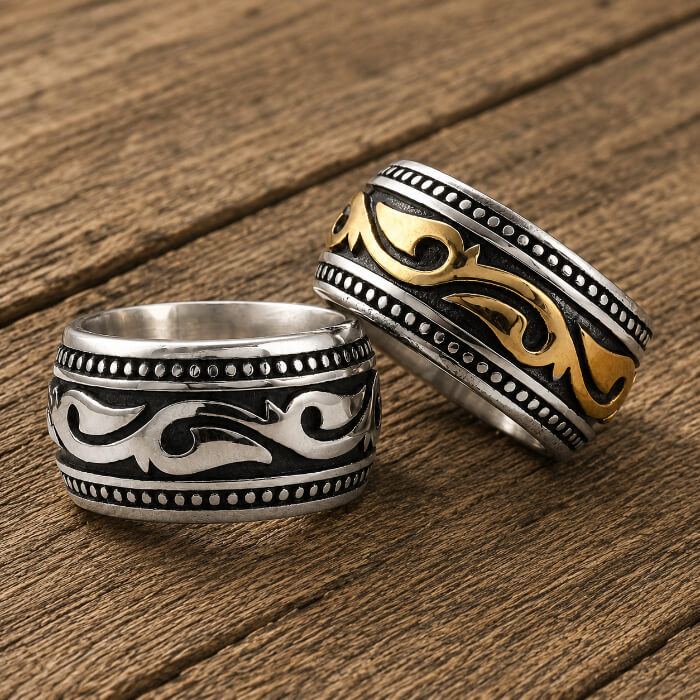 Silver-tone and gold-tone versions of a men's engraved stainless steel western band