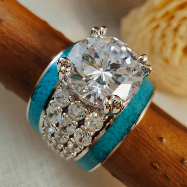 Sterling silver engagement ring with round diamond and turquoise accents