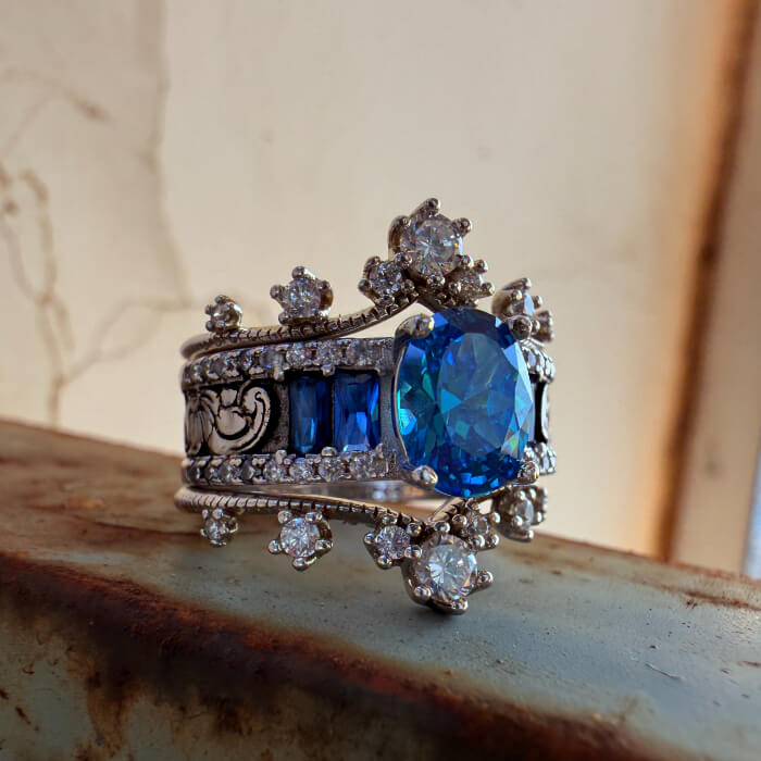 Elegant silver ring with large octagonal blue sapphire and diamond accents