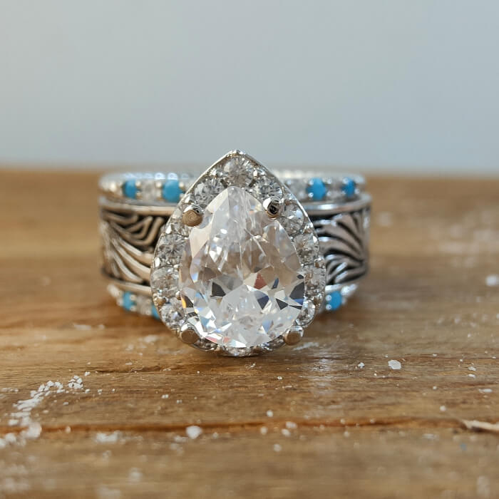 Turquoise and diamond pear-shaped ring in silver band