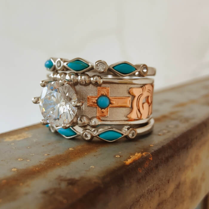 Vintage turquoise engagement ring set with diamond and intricate cross design
