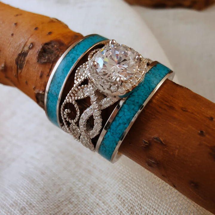 Sterling silver twist band engagement ring with moissanite and turquoise accents.