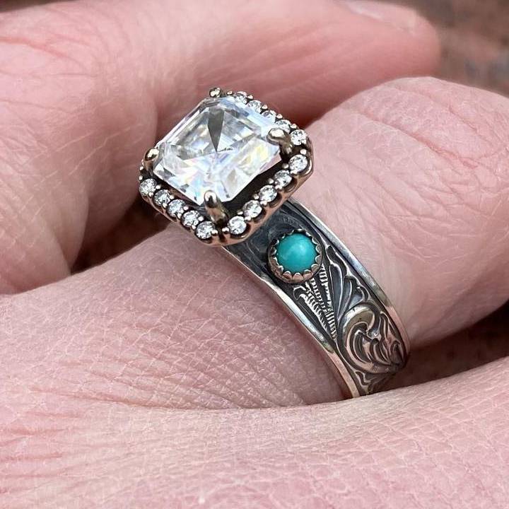 Turquoise engagement ring featuring radiant cut diamond and floral engraved band