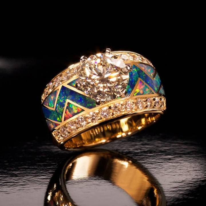 Gold ring featuring a large opal stone and turquoise inlay with diamond accents