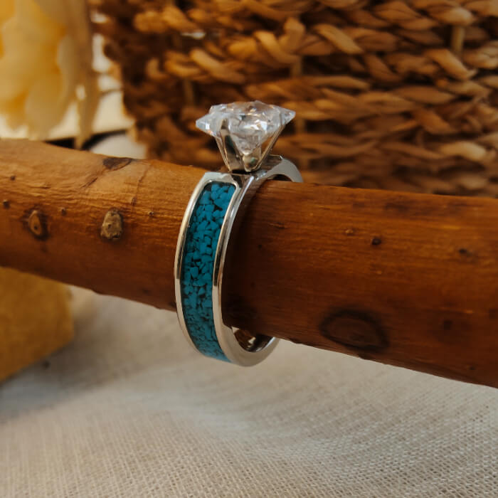 Steel bridal ring with blue turquoise inlay and princess cut zircon atop.