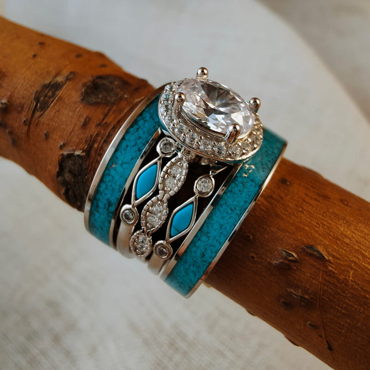 Sterling silver vintage wedding ring set with oval moissanite and turquoise accents.
