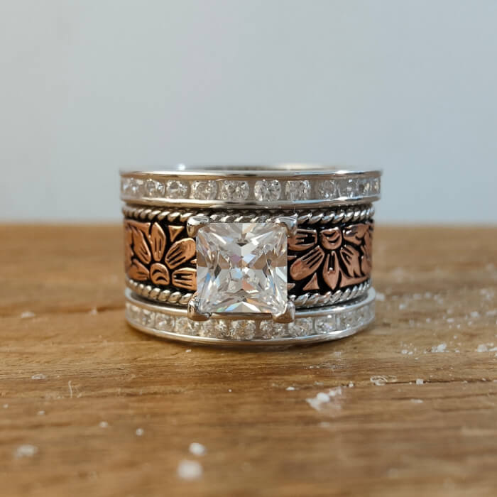 Western princess cut floral ring with diamond accents in rose gold and silver
