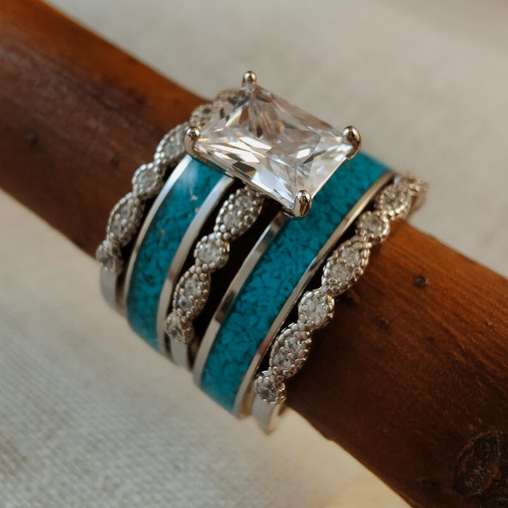 Vintage 5-piece turquoise and diamond ring set on wooden display