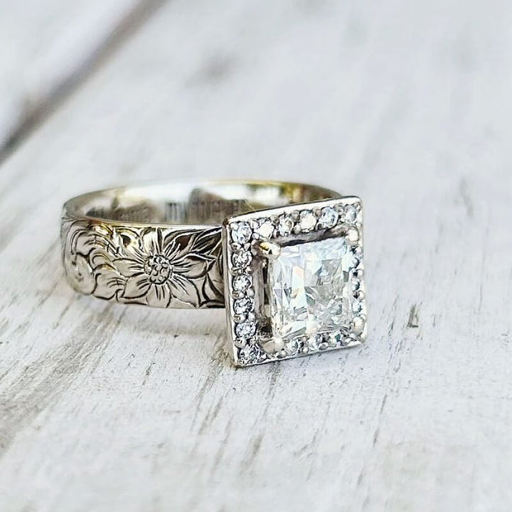 Western engagement ring with square zircon and diamond halo, floral engraved band