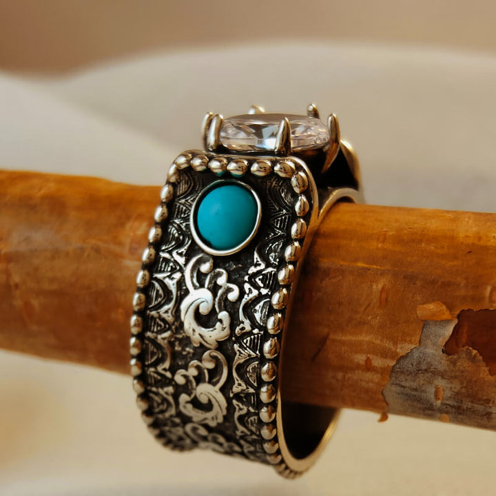Wave Engraved Flower Turquoise and Diamond Ring on wooden surface