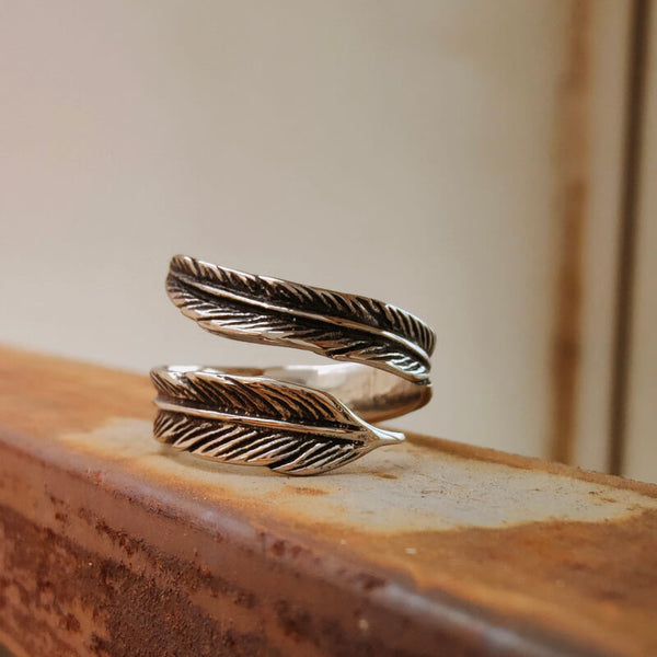 Silver feather wrap ring with detailed engraving