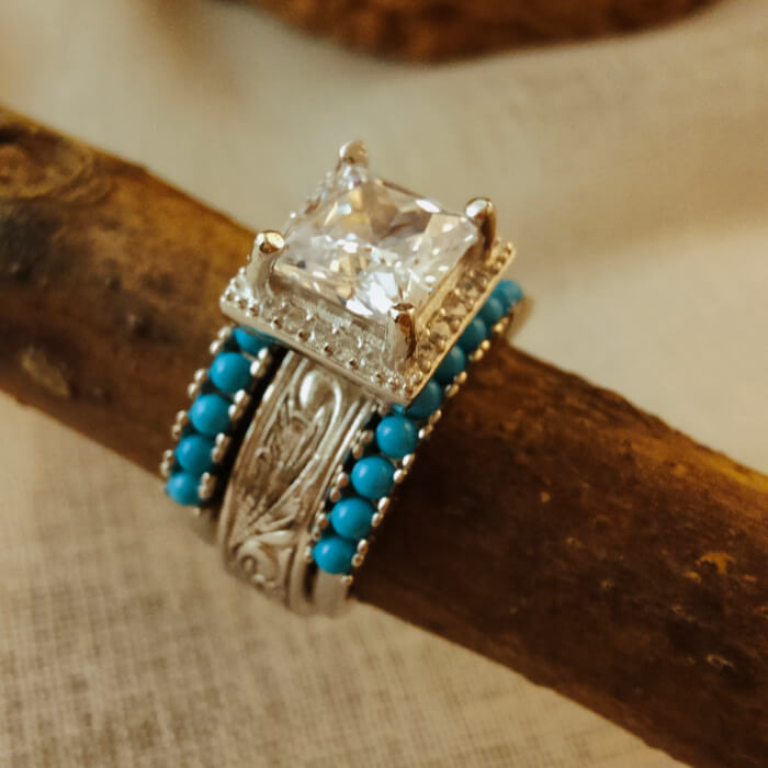 Western promise ring with diamond center and turquoise bead accents