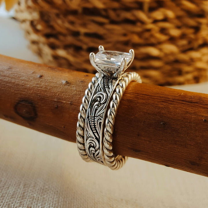 Engraved silver twist band ring with a large clear zircon stone