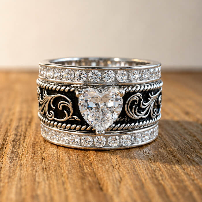 Three piece sterling silver western bridal ring set with heart shaped clear center stone and matching pavé bands
