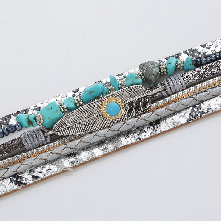 Vintage leather bracelet with turquoise stones and feather design
