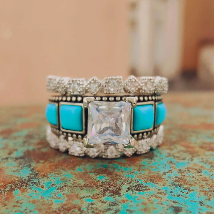 Sterling silver vintage ring set with turquoise and square zircon centerpiece