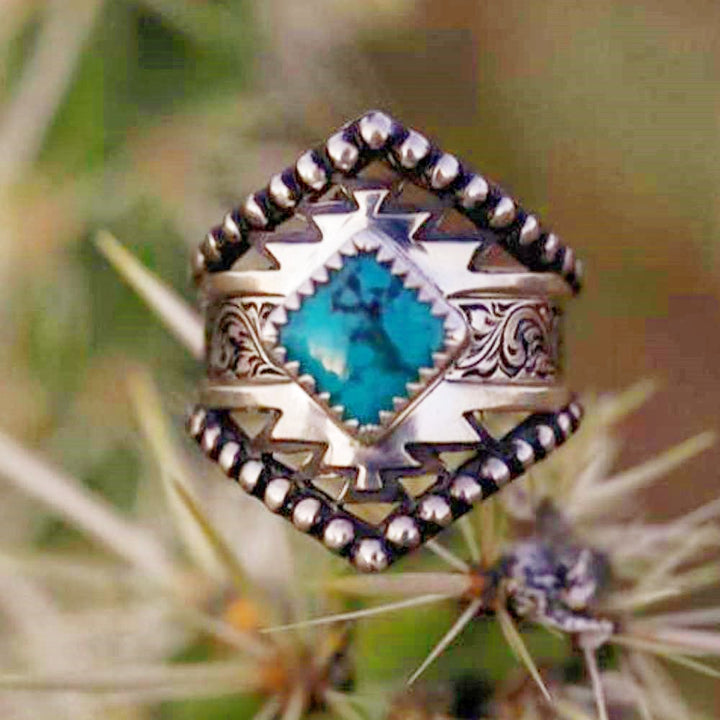 Square turquoise ring with Western engravings and silver accents