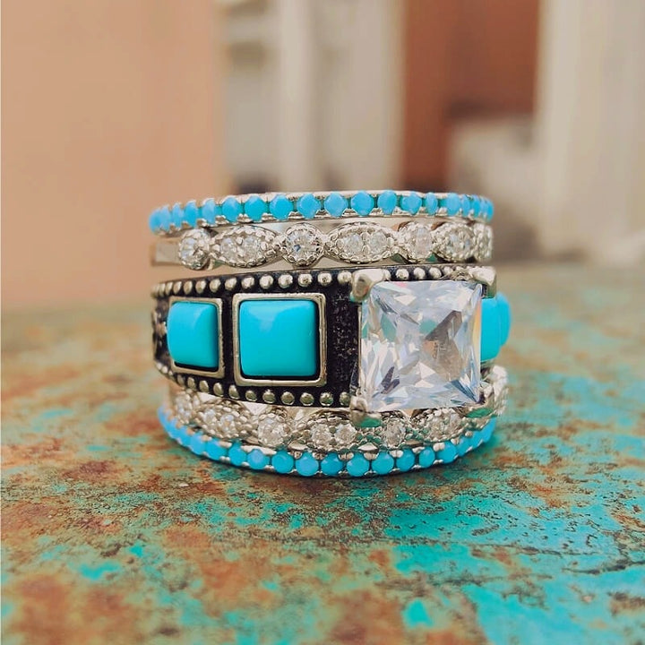 Vintage turquoise and zircon silver ring set with detailed silver accents