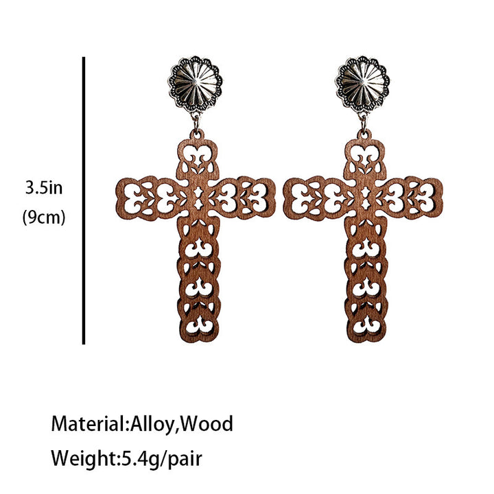 Hollow leather turquoise cross earrings with intricate designs and blue stone accents