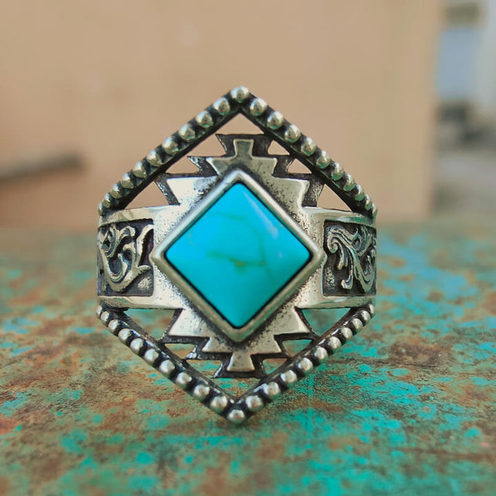 Vintage sterling silver ring with square turquoise stone and ornate engravings