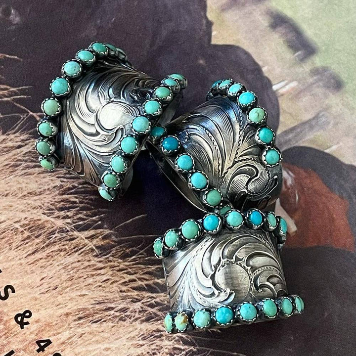 Wide band rings with turquoise accents and detailed engravings for women.