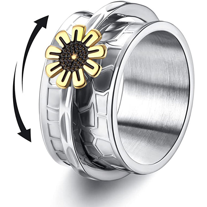 Steel rotating band ring with textured design and gold sunflower accent