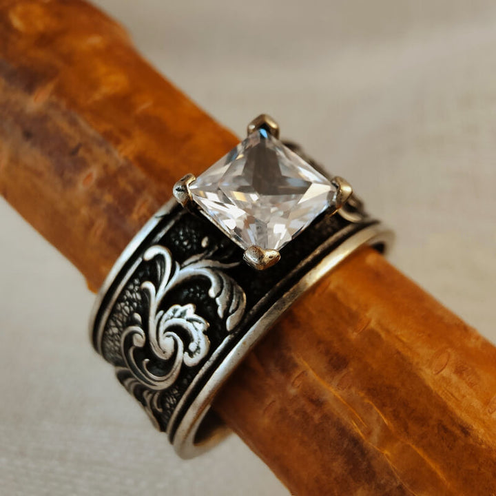 Handcrafted sterling silver ring with square clear zircon and intricate floral detail