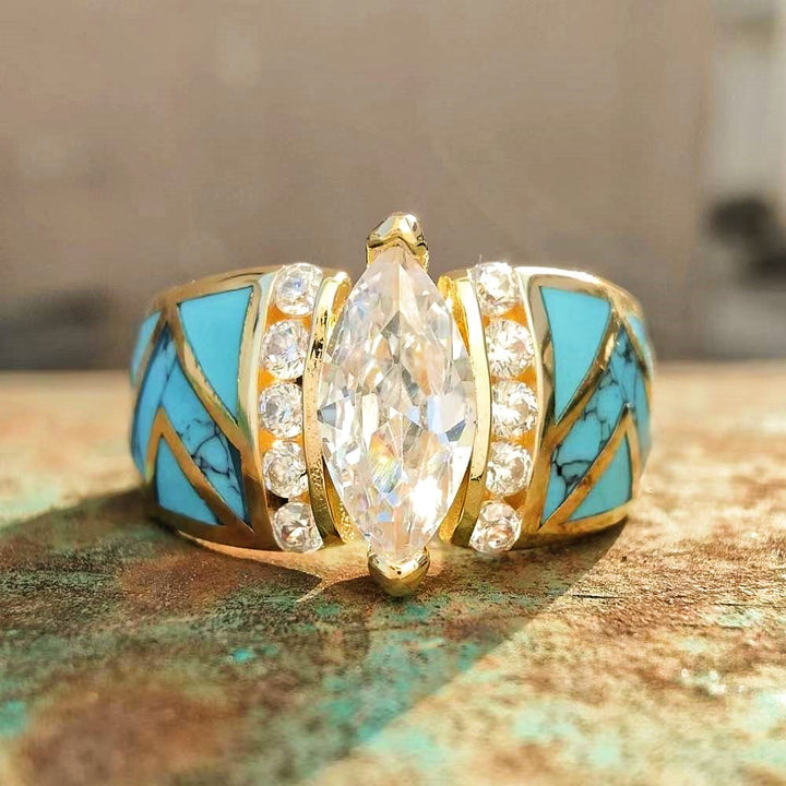 Marquise cut diamond center stone with turquoise inlay gold ring