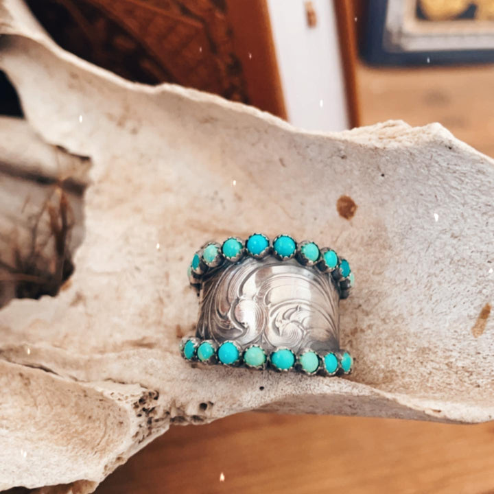 Wide silver band ring with turquoise stones and floral engravings for women