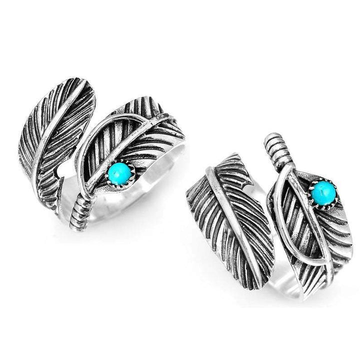Vintage turquoise feather ring with a silver band and a turquoise stone accent