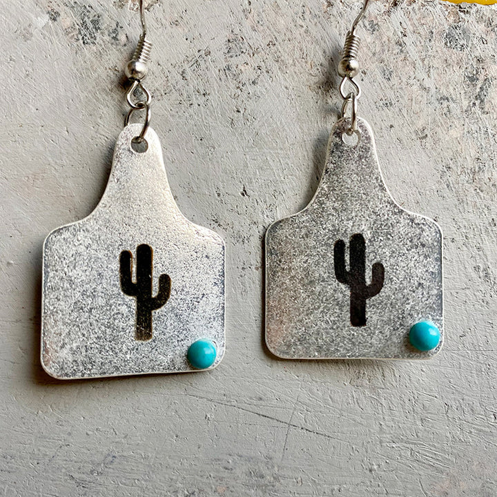 Silver Cow Cactus Earrings with turquoise accent and cactus design