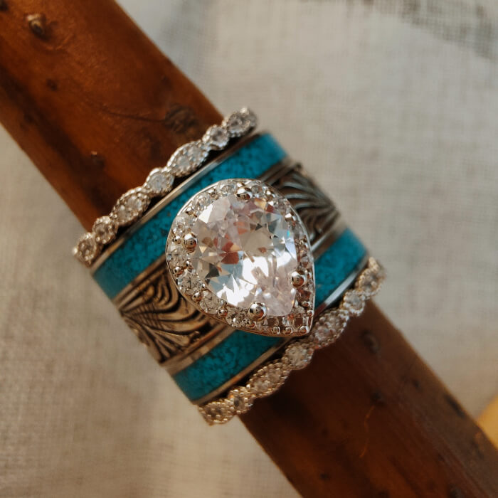 Sterling silver wedding rings with pear diamond and turquoise bands