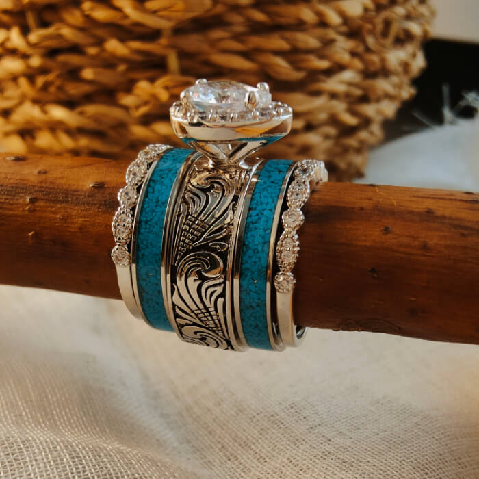 Sterling silver wedding ring set featuring a pear diamond and turquoise stripes.