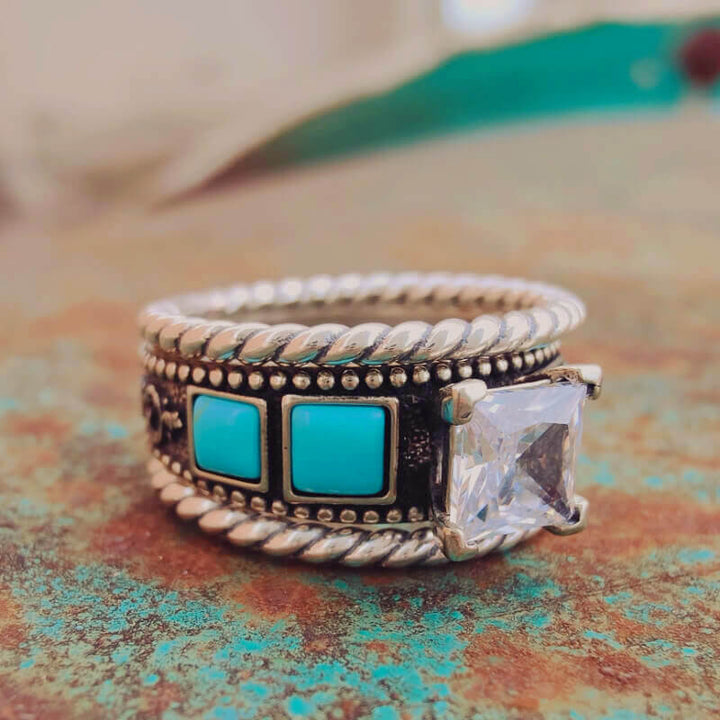 Silver twist band ring with square turquoise and diamond accents