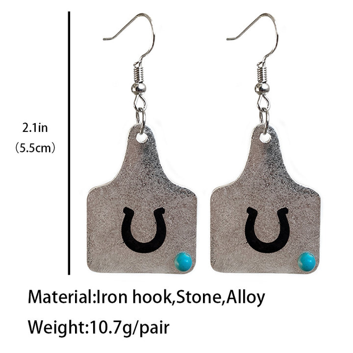 Cow tag earrings with black U design and turquoise accent, 2.1in long