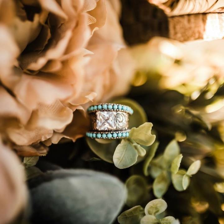 Turquoise and silver band ring with floral pattern and turquoise stones