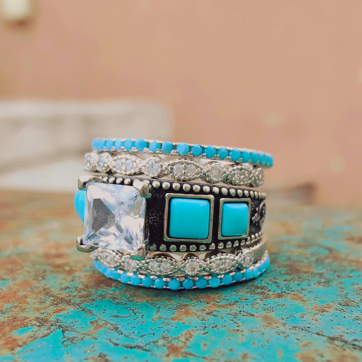 Vintage silver ring set with turquoise squares and a zircon centerpiece