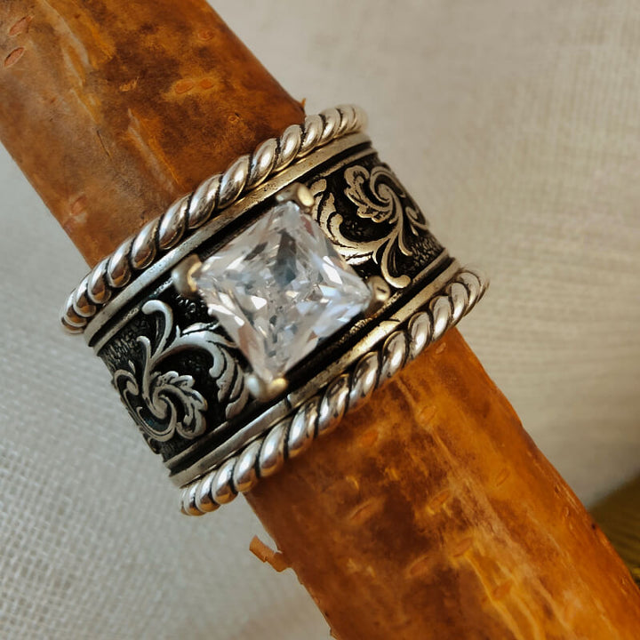 Sterling silver floral engraved ring set with a large clear zircon gemstone